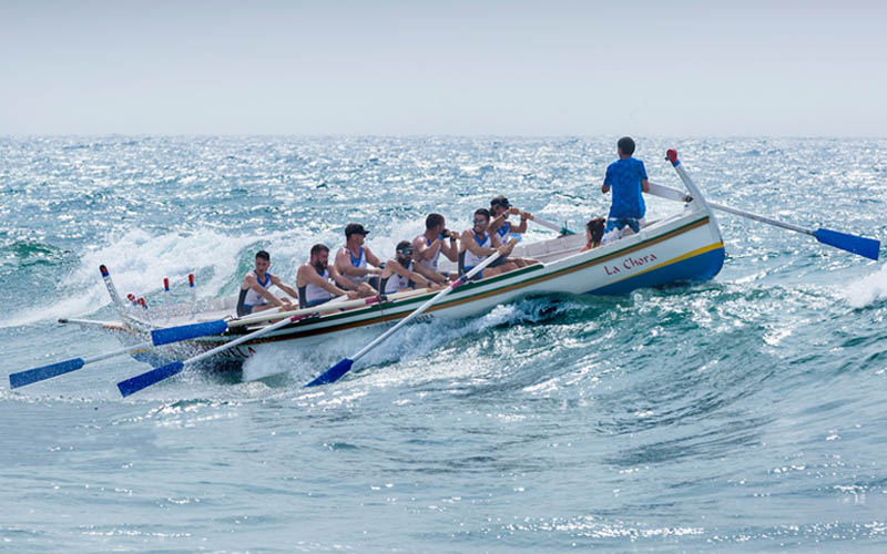 a group of men surviving on sea with a boat